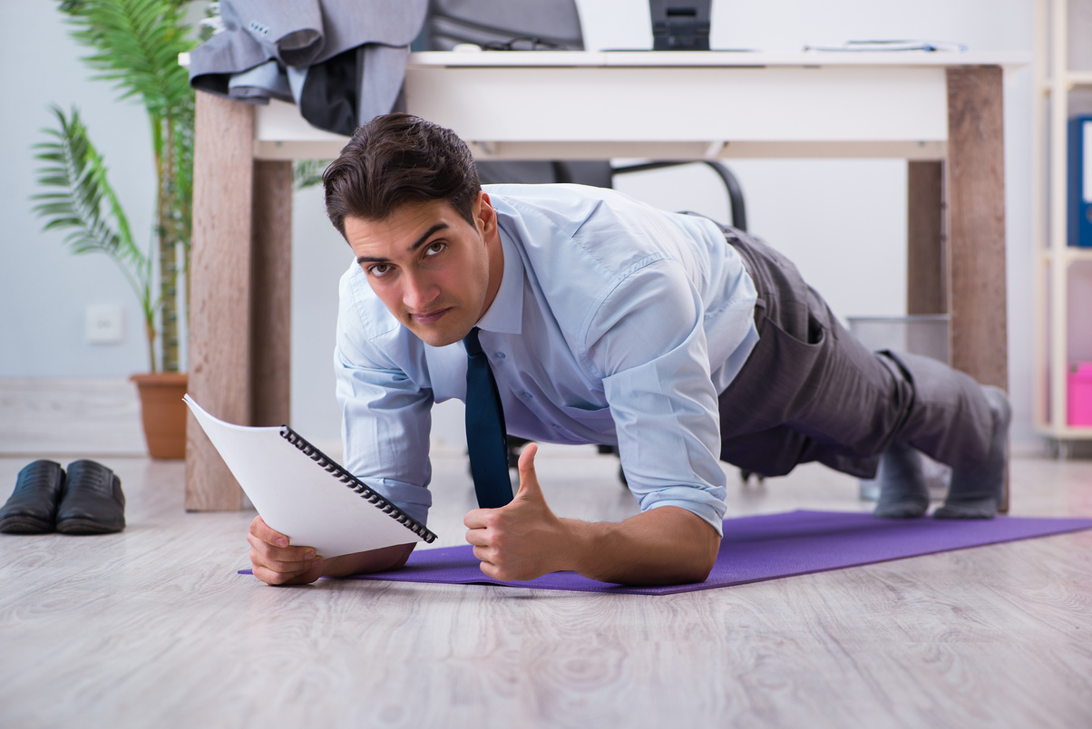 Businessman Doing Sports in Office during Break